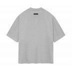 ESSENTIALS SS24 Gris — Camiseta y pantalones cortos